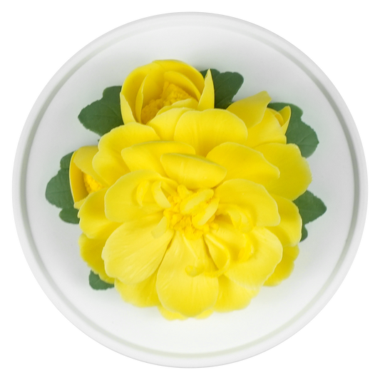 Luxury ceramic flower scent diffuser for home in yellow, ranunculus , displayed from above