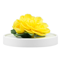 Luxury ceramic flower scent diffuser for home in yellow, ranunculus , displayed from front