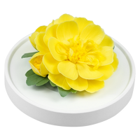 Luxury ceramic flower scent diffuser for home in yellow, ranunculus , displayed from side